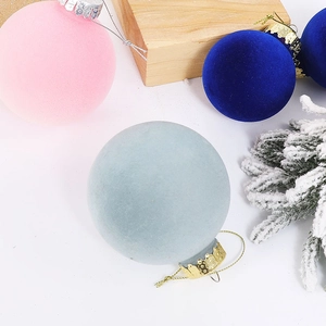 Detail showing pink blue and grey flocked Christmas balls with pine branches