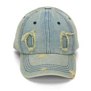 Light blue washed denim baseball cap with distressed rip details and a curved brim