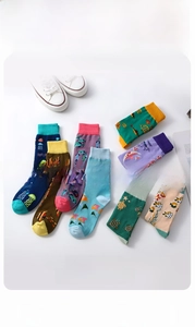 Macro view of ocean-themed cotton socks featuring jellyfish and sea turtle patterns