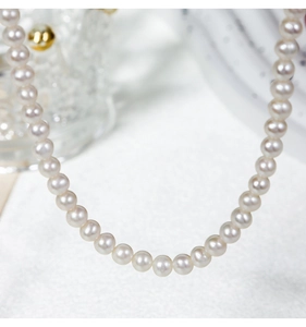 Macro shot of natural 5-6mm freshwater pearls on S925 sterling silver necklace