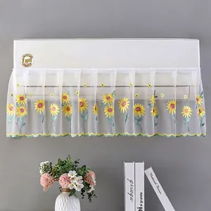 Detail of white lace AC cover featuring sunflower embroidery and mesh dustproof texture