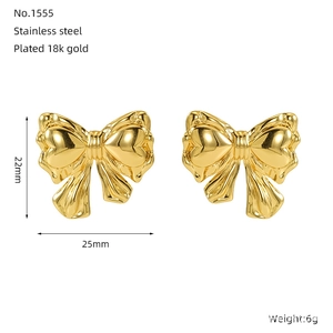 Detail view of 18k gold plated stainless steel bow earrings with 25mm size specs