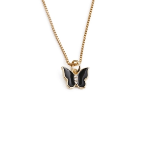 Detail of a gold-plated butterfly necklace with black enamel inlay and sparkling rhinestones