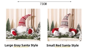 Detail view of large grey and small red Christmas forest gnomes with 73cm wing span