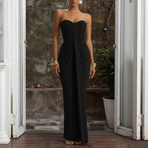 Detail showing the ruched texture and slim fit design of a black tube maxi dress