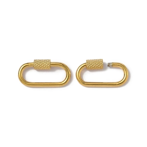 Close-up of golden oval screw lock connectors showing open and closed threading detail