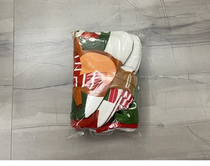 Detail of bulk-packed knitted Christmas stockings in festive red, green and white colors