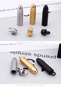 Macro shot of three-color bullet pendants showing threaded screw cap and metal texture