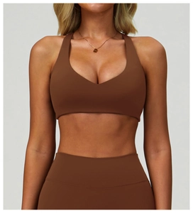 Close-up of deep chocolate brown high-stretch sports bra and leggings set with V-neckline