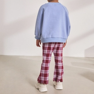 Girls retro casual outfit with light blue sweatshirt and red checkered flare pants