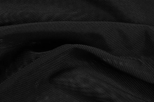 Close-up of high-quality black mesh fabric texture with subtle sheer finish and soft drape