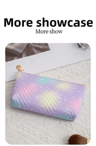 Detailed view of gradient polyester makeup bag with V-shaped quilting and snowflake pattern