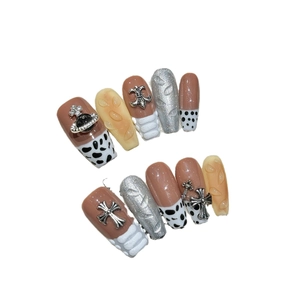 Brown leopard print press-on nails with 3D sweater texture and metallic planet charms