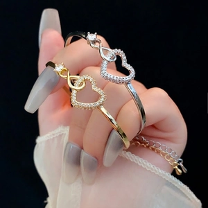 Zircon heart and infinity bracelets in gold and silver finish for a luxury style