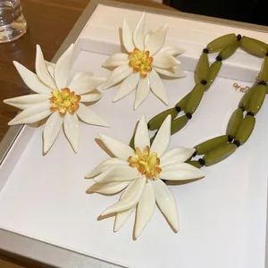 Resin flower jewelry set with bamboo style cream petals and olive green beaded necklace