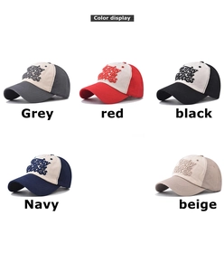 Close-up of three-dimensional embroidered lettering on various colored cotton baseball caps
