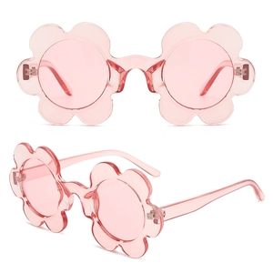 Detailed close-up of pink flower-shaped sunglasses with transparent PC frames