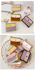 Detailed view of macaron color block PU leather wallet with heart pendant zipper