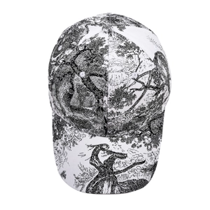 Detailed view of white cotton baseball cap with black Toile de Jouy floral tree pattern