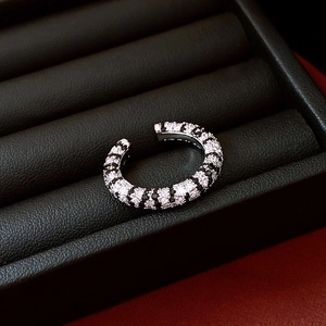 Macro view of French vintage striped zircon ring with black and white pavé setting