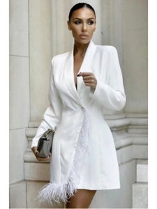 Detail of the white blazer dress featuring elegant feather trim and V-neckline sleeve cuffs