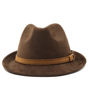 Macro shot of dark brown fedora hat with decorative leather band and metal buckle detail