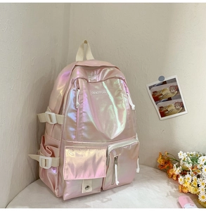 Detail of laser PU holographic pink backpack with metallic finish and side pocket