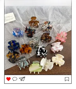Macro detail of various acetate hair claws in marble and tortoiseshell patterns