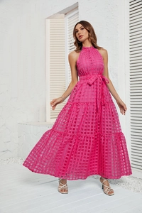 Macro view of rose pink tiered dress with textured mesh fabric and tiered ruffled hem