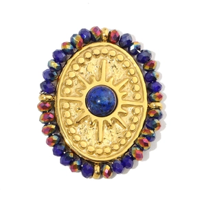 Detail of gold oval lapis lazuli pendant with iridescent beads and vintage design
