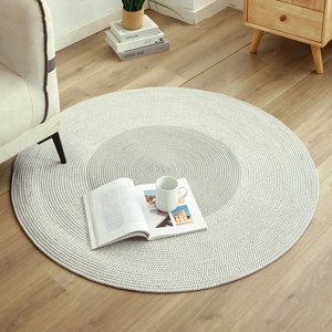 Nordic round woven cotton area rug in grey and white tones for minimalist living room