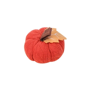 Orange knitted pumpkin decoration with brown stem and yellow felt leaf for harvest