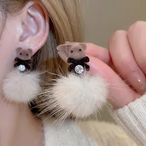 Brown flocked bear stud earrings with white fur pompom and rhinestone accents for autumn