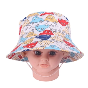 Detail of kids white bucket hat with colorful car print and adjustable chin strap