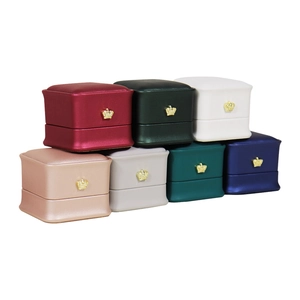 Elegant leather jewelry boxes with gold crown accents in various sophisticated colors