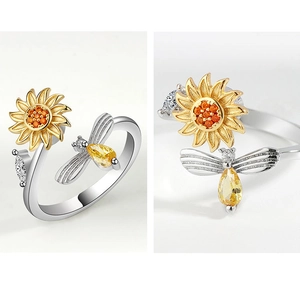 Detailed macro view of rotatable sunflower and crystal bee on adjustable silver ring