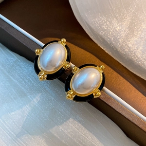 Baroque style gold plated drop oil earrings with white faux pearl and black enamel finish