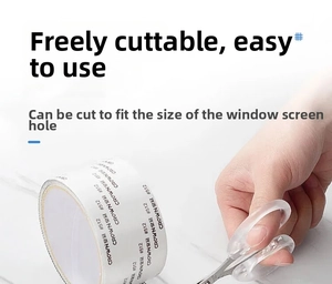 Cutting the self-adhesive window screen repair tape to size with scissors on a white roll