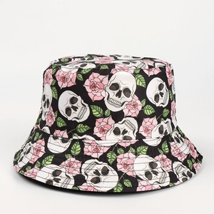 Reversible bucket hat featuring skull and pink rose print on black canvas fabric