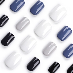 Short square press-on nails in navy blue, grey, and black with a glossy glazed finish