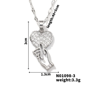 Detailed view of heart gesture pendant showing dimensions 3cm by 1.3cm and 45cm chain length