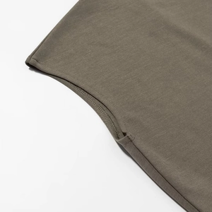 Detail of premium charcoal gray knit dress showing seamless stitching and hemline finish