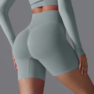 Detail showing high-waisted seamless ribbed gym shorts with scrunch butt lifting effect