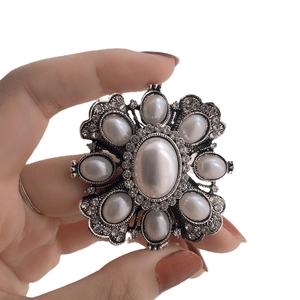 Elegant baroque silver brooch with large artificial pearls and sparkling rhinestones
