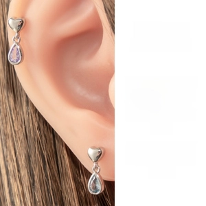 Detail of heart stud earring with teardrop gemstone pendant in purple and blue titanium steel