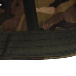 Detail view of reinforced brim stitching and ripstop fabric on camouflage tactical cap