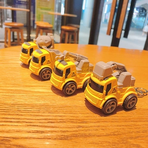 Mini cartoon pull-back construction vehicle keychains for kids in yellow plastic finish