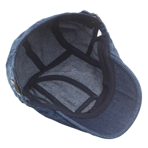 Internal view of washed denim flat cap with sweatband and brass adjustment buckle