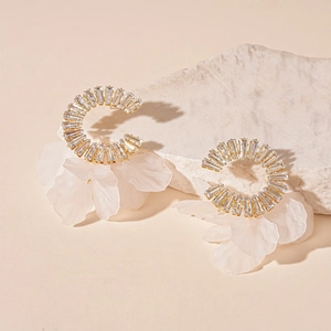 Elegant C-shaped earrings with gold metal, rectangular crystals and white petal charms
