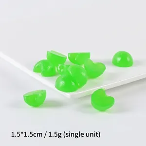 Miniature lime green PVC fruit slices 1.5cm for DIY crafts on a white ceramic plate